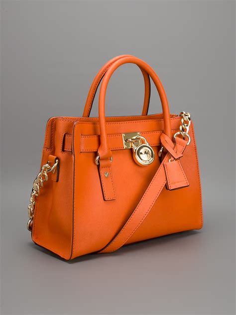 sac michael kors orange|michael kors manhattan silver bag.